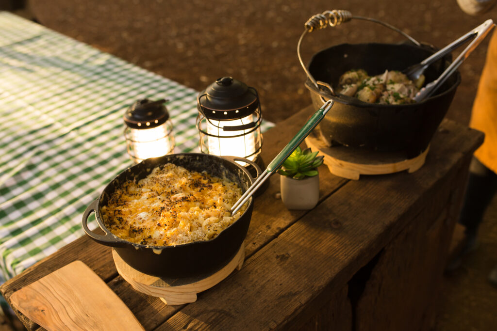 Pasta and chicken camping meal prepared in cast iron